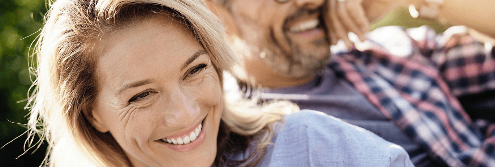 glossary-couple-laughing-in-car-1600x540