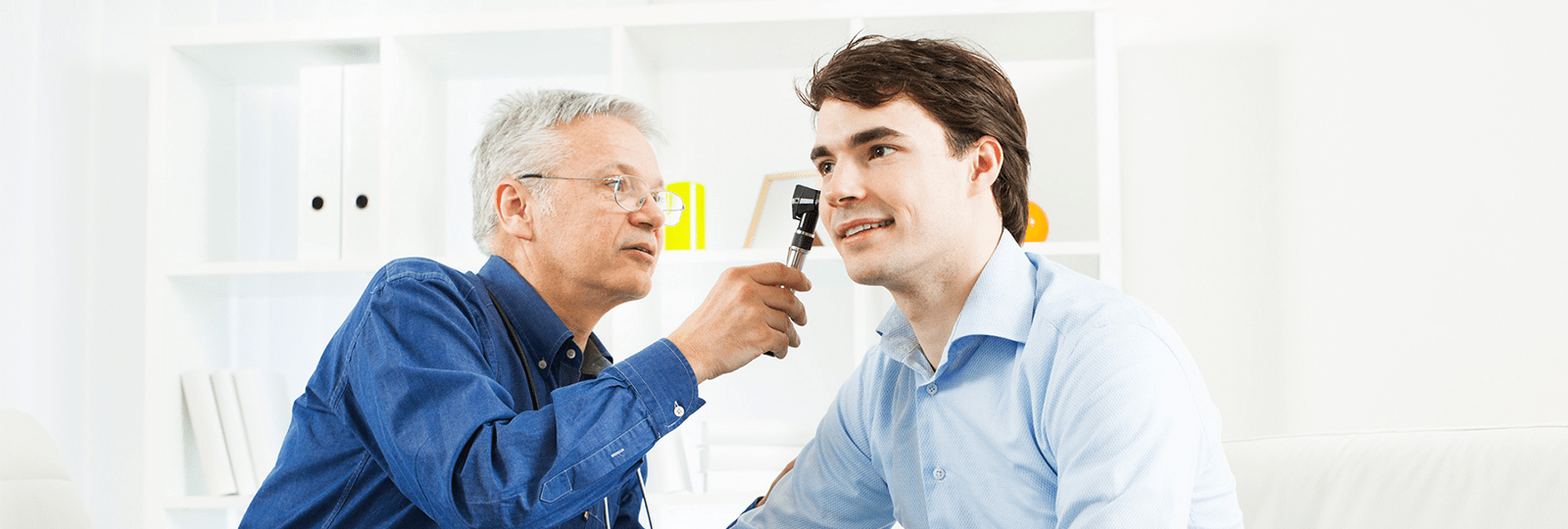Man takes ear examination