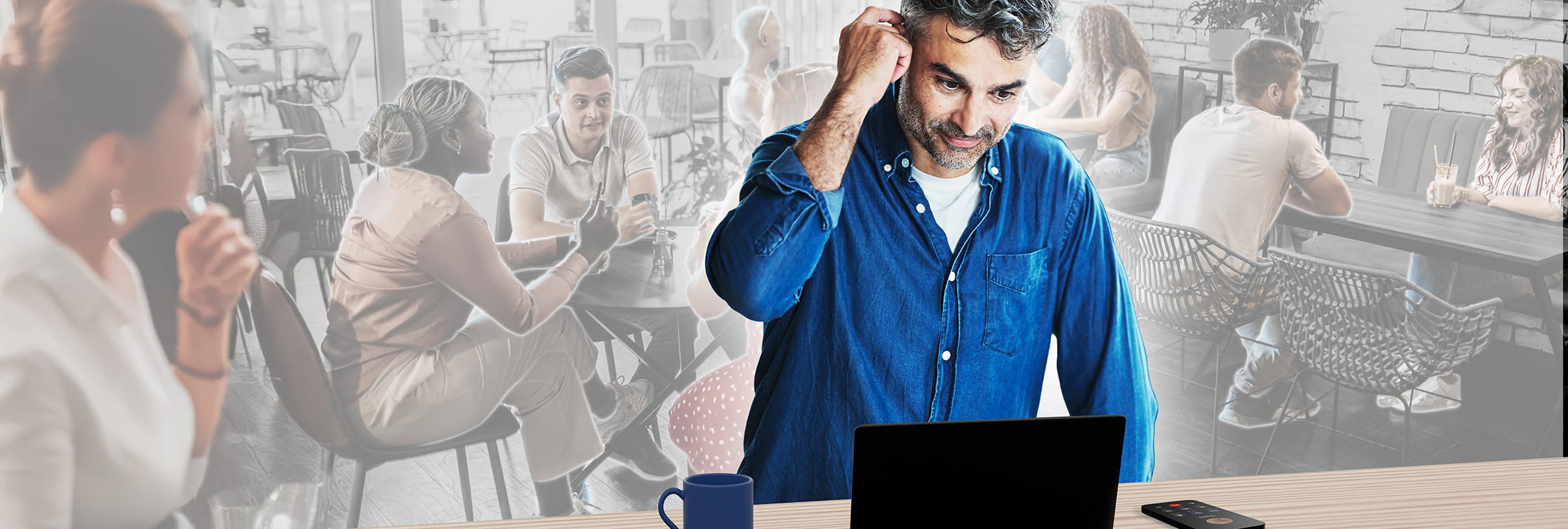 people in a cafe working and talking
